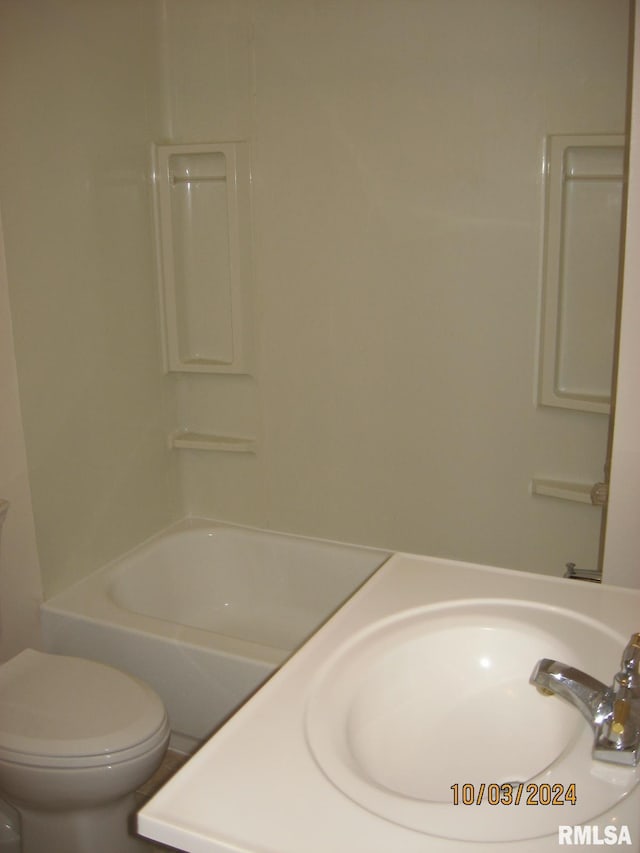 full bathroom featuring toilet, sink, and bathing tub / shower combination