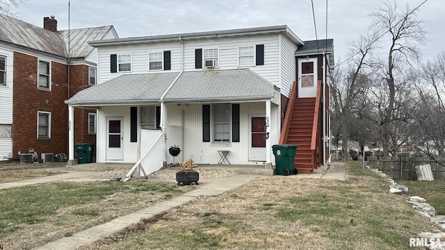 view of front of home featuring central air condition unit and covered porch