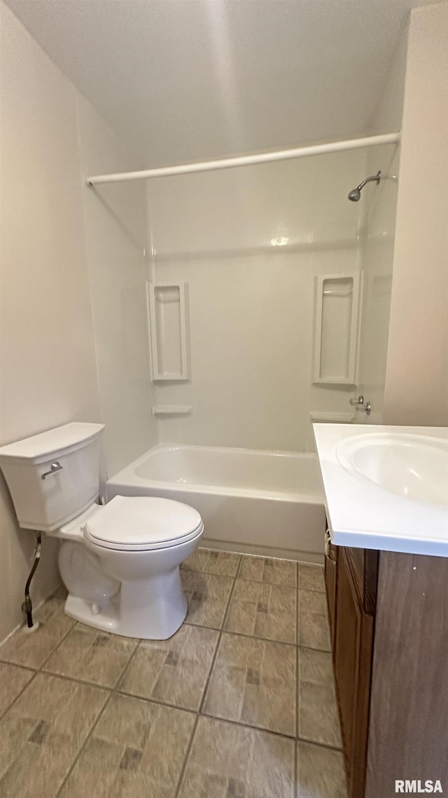 full bathroom featuring shower / bathing tub combination, vanity, and toilet