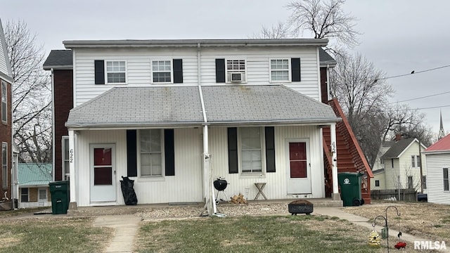 view of front property featuring a porch and a front lawn