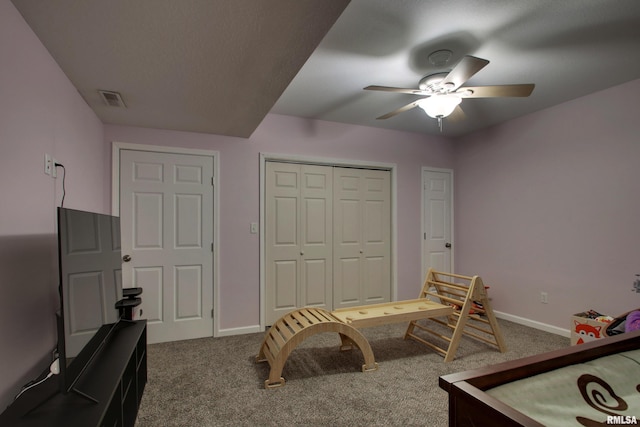 bedroom featuring ceiling fan and carpet floors