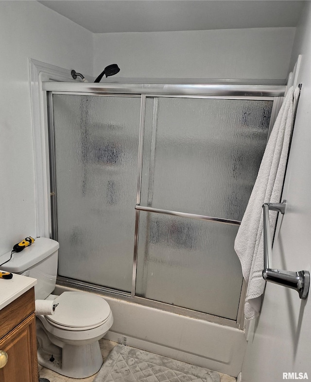 full bathroom featuring toilet, vanity, and combined bath / shower with glass door