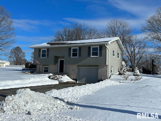 split foyer home featuring a garage