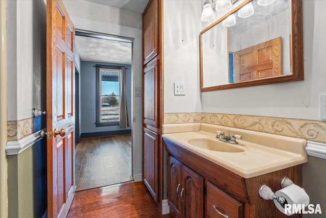 bathroom featuring wood-type flooring and vanity