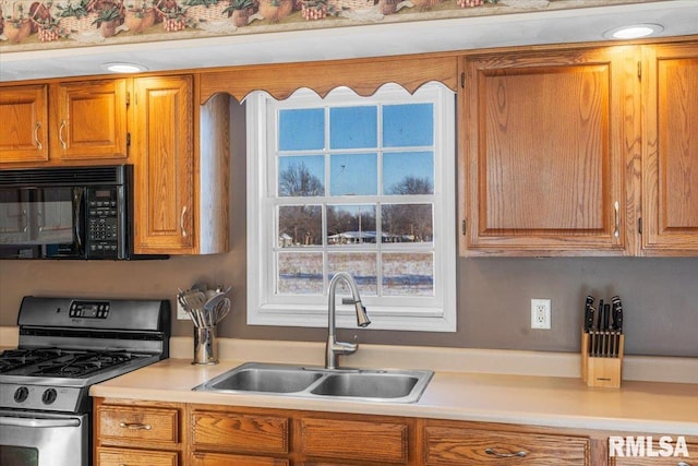 kitchen featuring sink and gas range