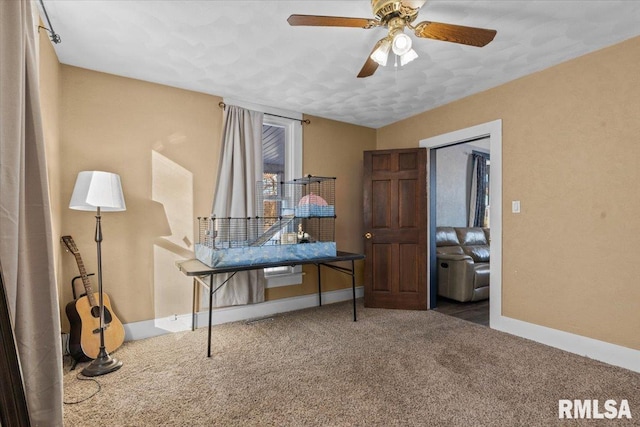 office area with ceiling fan and carpet floors