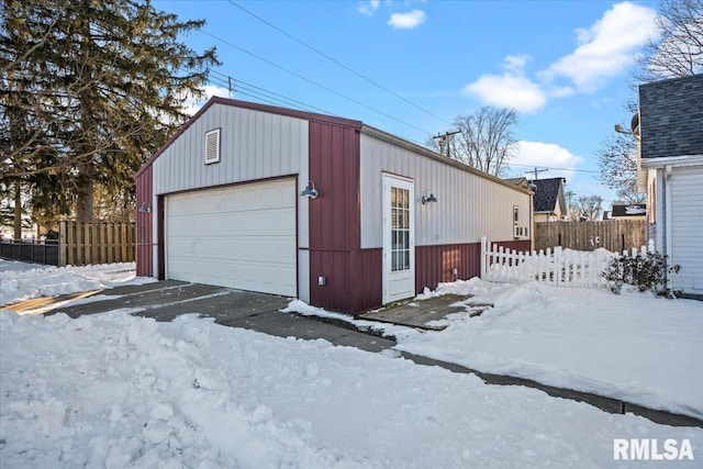 view of snow covered garage