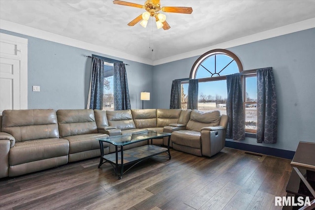 living room featuring crown molding, dark hardwood / wood-style flooring, and ceiling fan