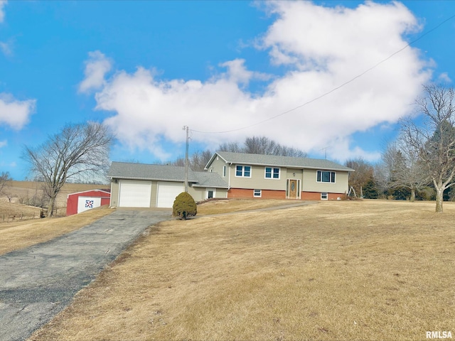 raised ranch with a front lawn