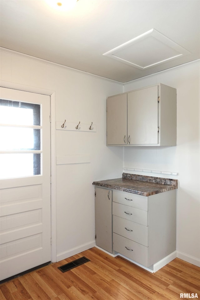 kitchen featuring gray cabinets and light hardwood / wood-style floors