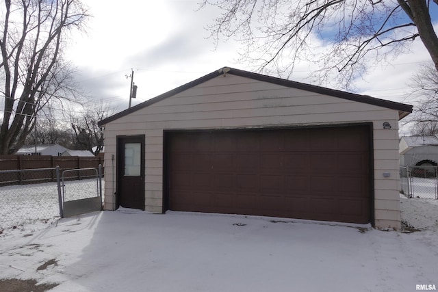 view of snow covered garage