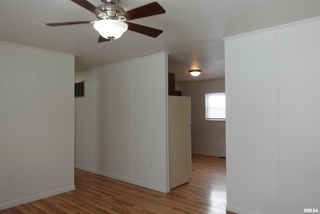 unfurnished room featuring ceiling fan and wood-type flooring