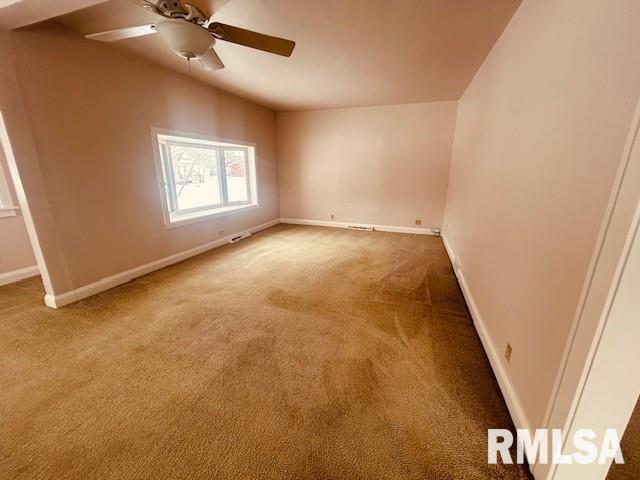 carpeted empty room with ceiling fan