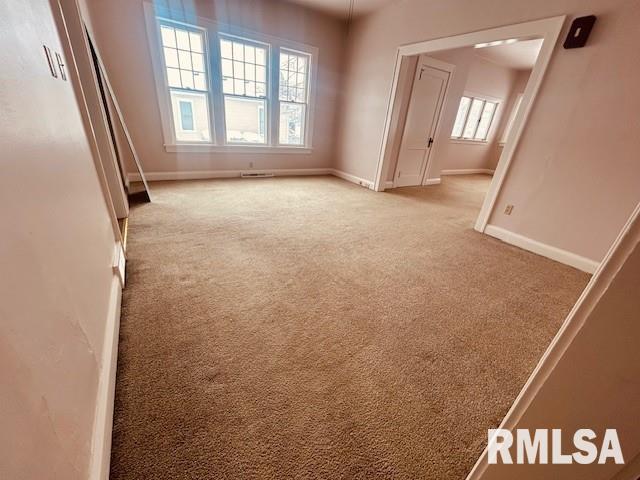 spare room with light colored carpet