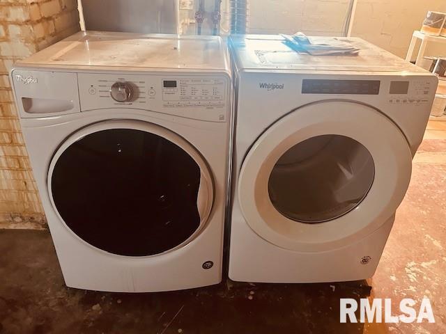 laundry room featuring separate washer and dryer