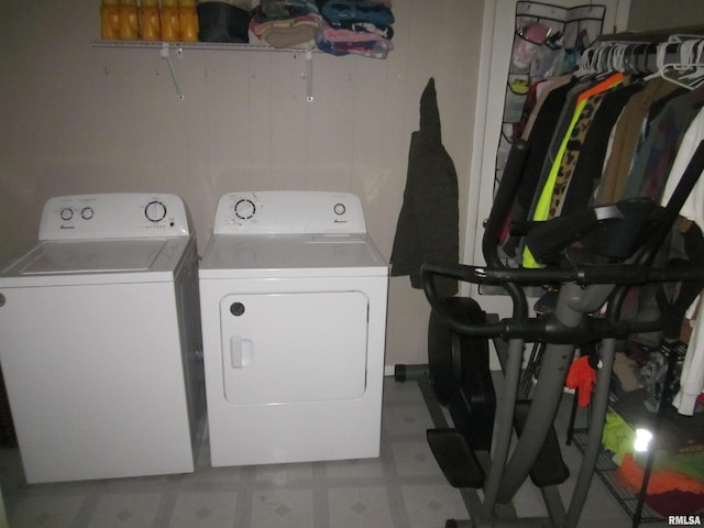 washroom with washing machine and clothes dryer