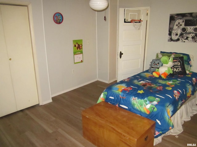 bedroom with dark wood-type flooring