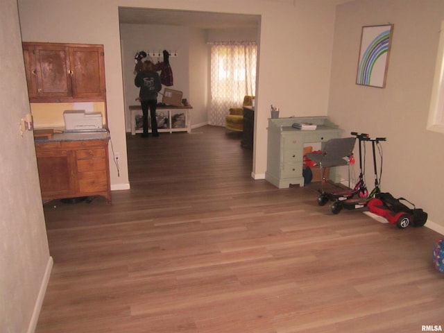 hall with hardwood / wood-style floors