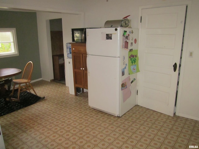 kitchen featuring white fridge