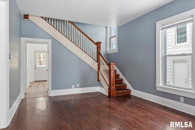 stairs with wood-type flooring