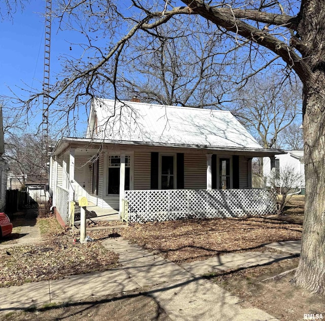 view of front of property with metal roof and a porch