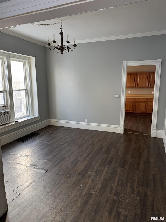 unfurnished dining area featuring a notable chandelier, dark wood-style flooring, baseboards, and ornamental molding