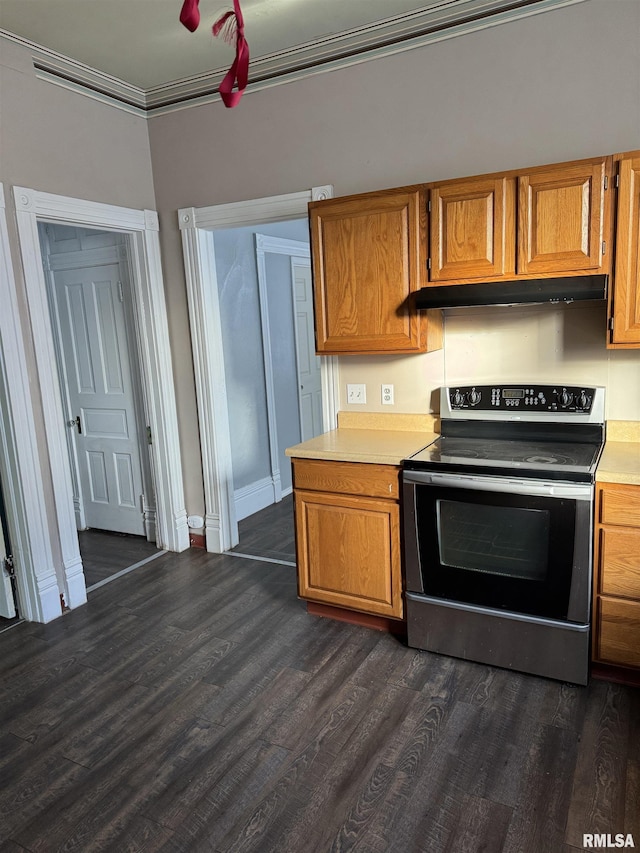 kitchen with crown molding, stainless steel electric stove, light countertops, and brown cabinets