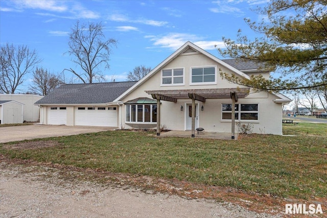 view of front of house with a porch, a garage, and a front lawn