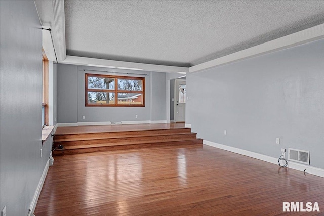 interior space featuring hardwood / wood-style floors and a textured ceiling