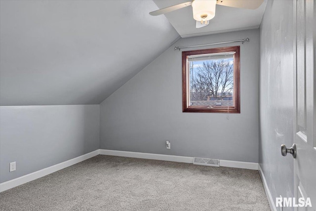 bonus room with carpet flooring, vaulted ceiling, and ceiling fan