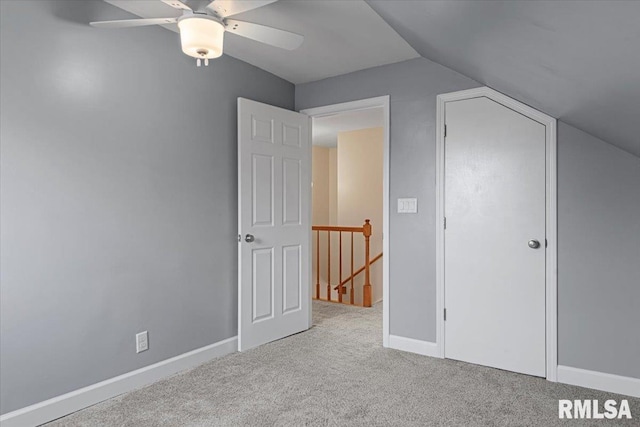 bonus room with ceiling fan, light colored carpet, and lofted ceiling