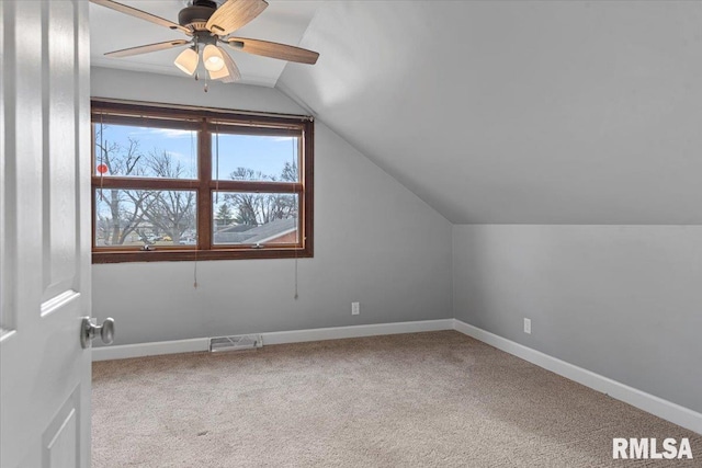 additional living space with ceiling fan, carpet floors, and lofted ceiling