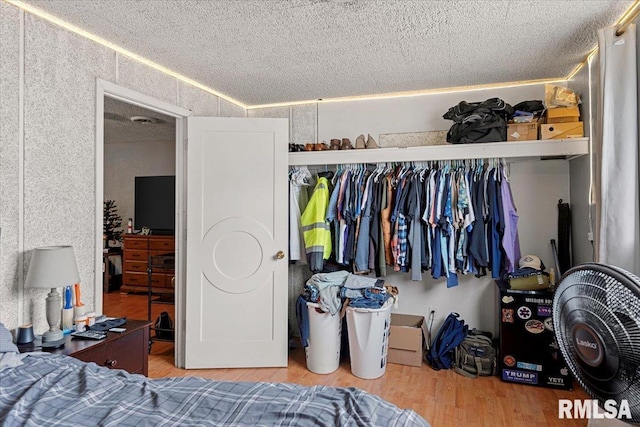 bedroom with hardwood / wood-style floors