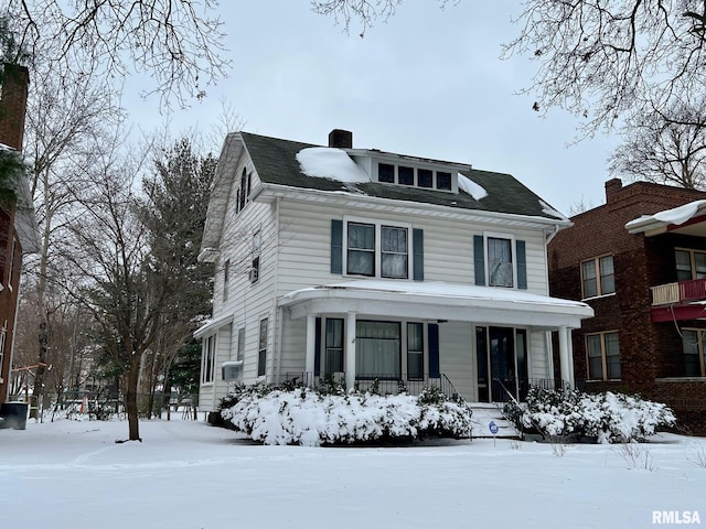 view of front facade with cooling unit and covered porch