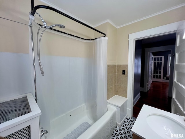 bathroom featuring shower / bath combo, vanity, and ornamental molding