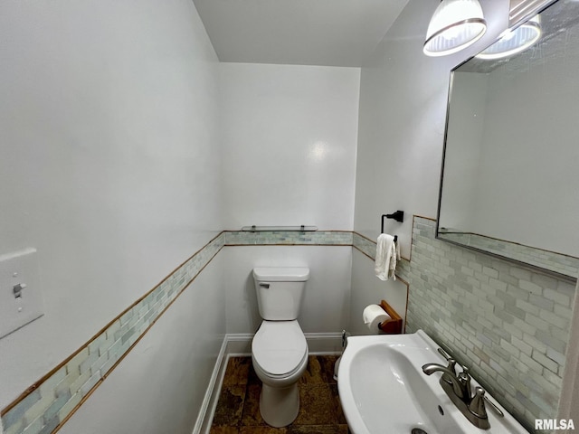 bathroom with toilet and sink