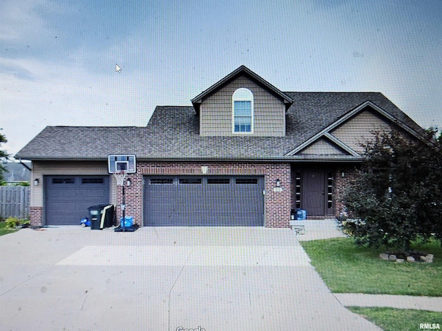 view of front facade with a garage, a front yard, and an AC wall unit