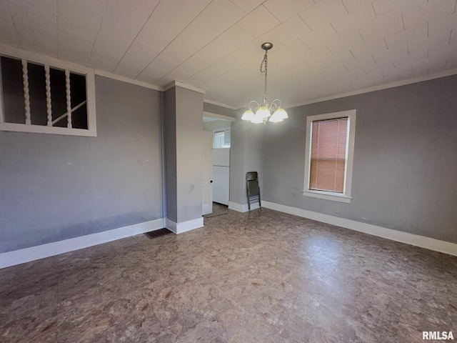 unfurnished dining area with a chandelier and ornamental molding