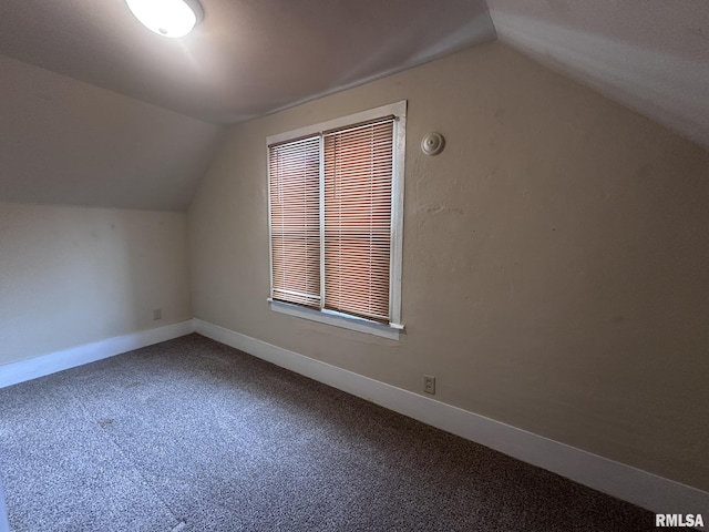 bonus room with carpet and vaulted ceiling