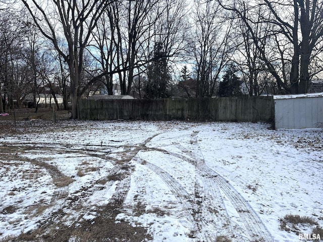 view of yard covered in snow