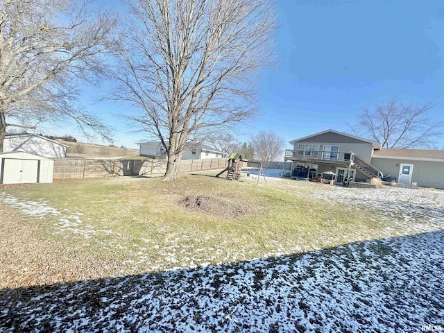 view of yard with a playground and a storage shed