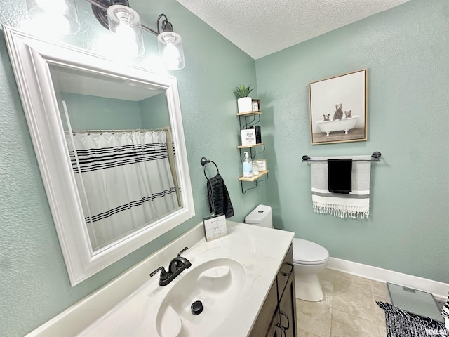 bathroom featuring tile patterned flooring, vanity, toilet, and a textured ceiling