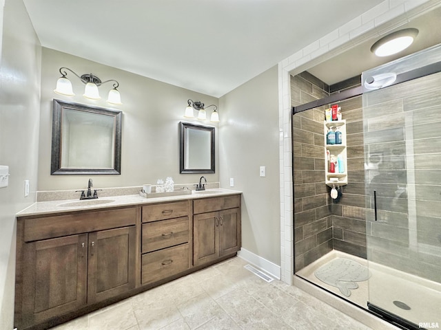 bathroom featuring vanity and a shower with shower door