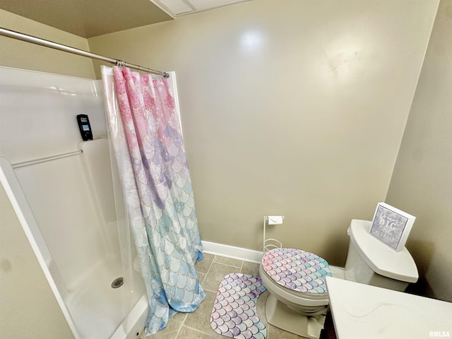 bathroom with tile patterned floors, toilet, and a shower with shower curtain