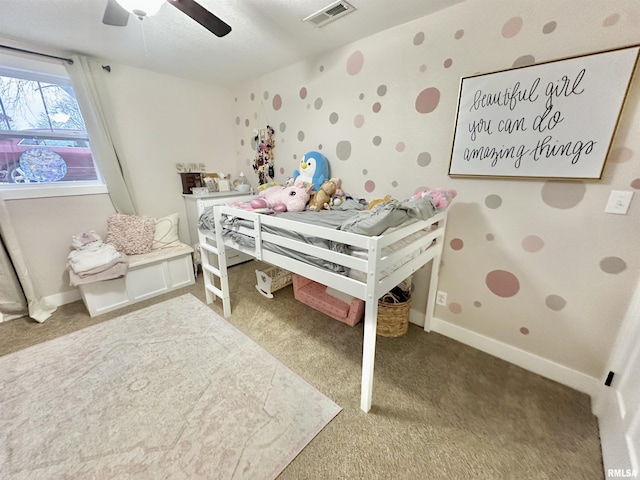 bedroom featuring ceiling fan and carpet