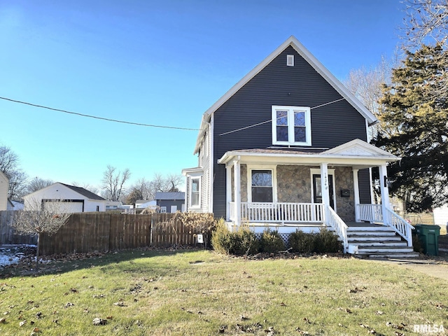 view of front of property featuring a front lawn and covered porch