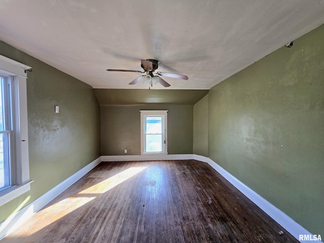 spare room featuring hardwood / wood-style flooring, ceiling fan, and lofted ceiling