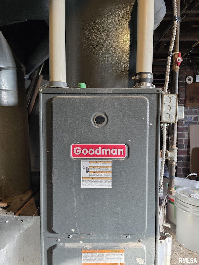 utility room featuring heating unit