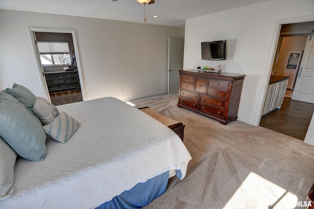 carpeted bedroom featuring ceiling fan