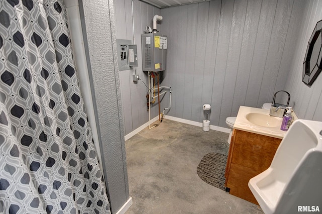 bathroom with concrete flooring, vanity, tankless water heater, and a shower with shower curtain